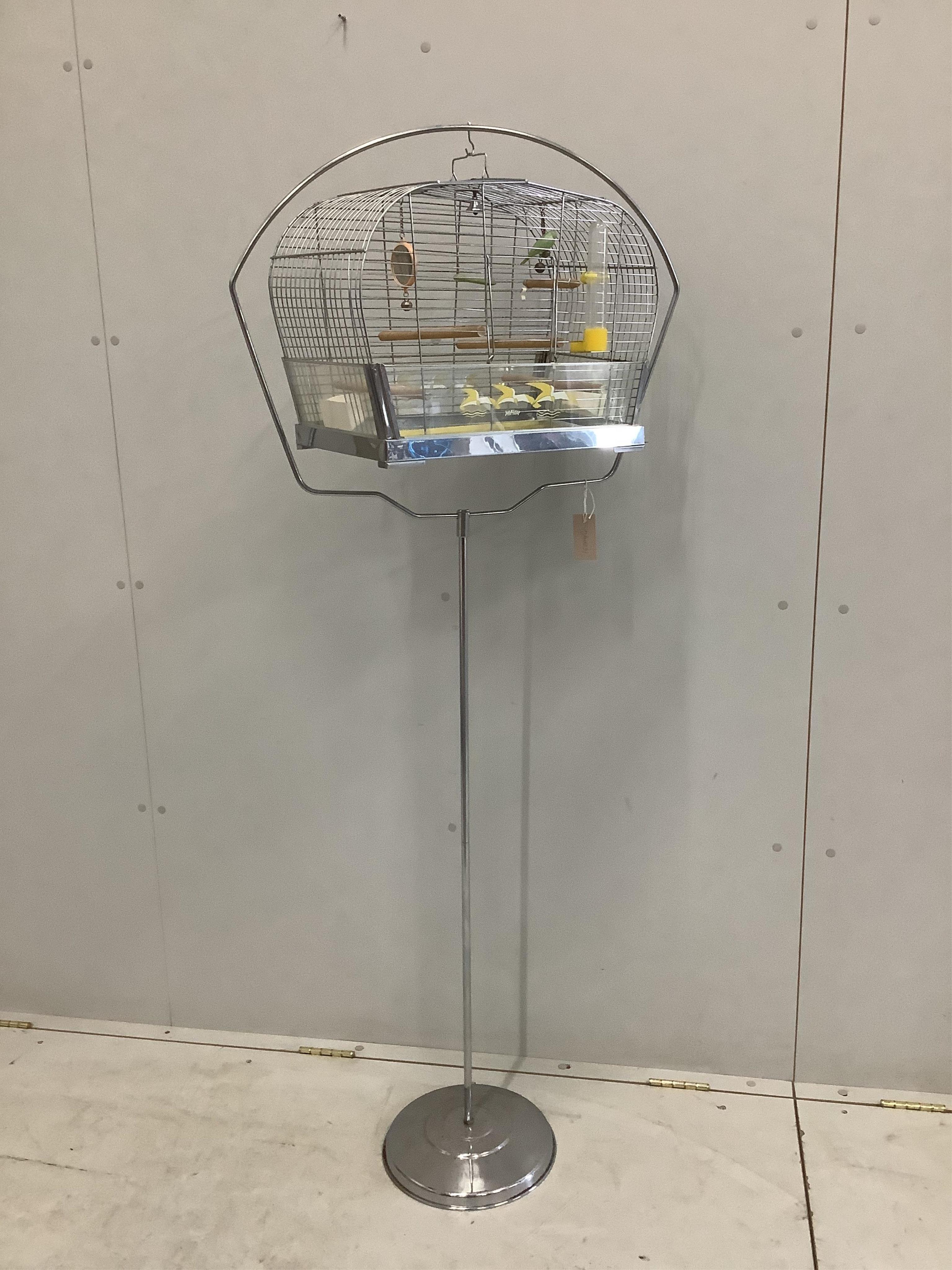 A vintage Genykage chrome plated bird cage on stand, height 160cm. Condition - fair to good